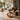 Round Side Table with Two-Tier Shelves and Sculptural Loop Base