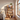 Curved Frame Solid Wood Bookshelf With Symmetrical Tiered Shelves