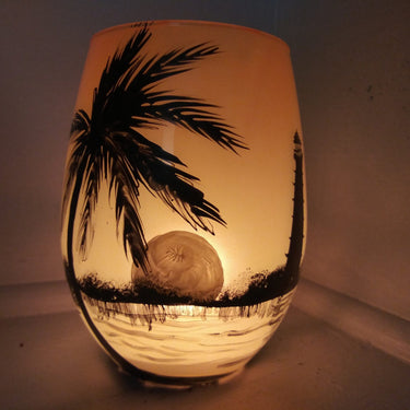 Sunset in the sea palm tree and lighthouse